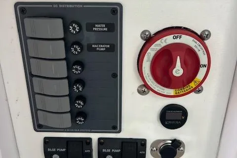 Slide: The Image of Control panel of a 1971 Mariners BAJA 30 boat with switches and a red dial. - 16