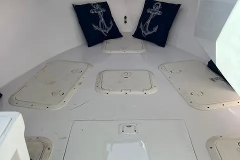 Slide: The Image of Interior of 1971 Blackman Mariners Baja 30 boat with anchor-themed pillows. - 19