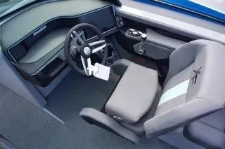 Slide: The Image of 2025 MasterCraft XT22 T boat interior with modern steering and seating design. - 8