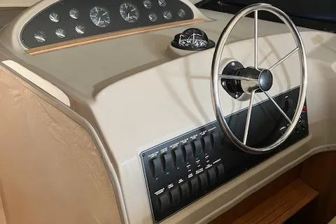 Slide: The Image of 2001 Bayliner 3988 Motoryacht helm with steering wheel and control panel. - 11