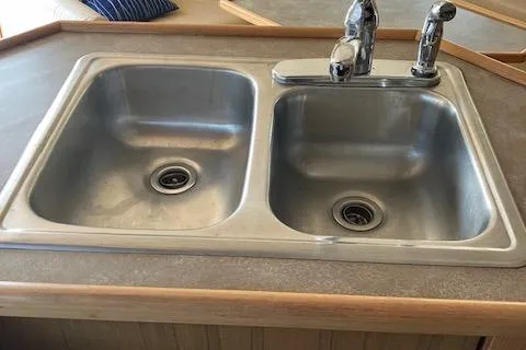 Slide: The Image of Stainless steel double sink in 2001 Bayliner 3988 Motoryacht kitchen area. - 17