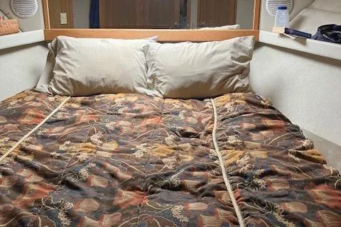 Slide: The Image of 2001 Bayliner 3988 Motoryacht cabin with cozy bed and floral bedding. - 27