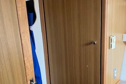 Slide: The Image of Interior view of 2001 Bayliner 3988 Motoryacht with wooden paneling and closet. - 29