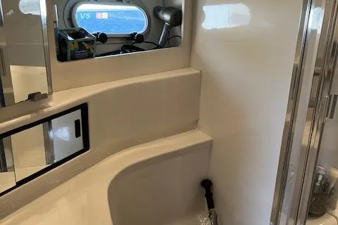 Slide: The Image of 2001 Bayliner 3988 Motoryacht bathroom with mirror and storage shelves. - 30