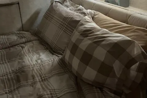 Slide: The Image of Cozy bedroom interior of 2001 Bayliner 3988 Motoryacht with plaid bedding. - 35