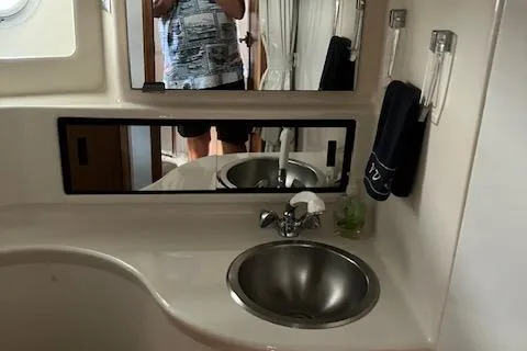 Slide: The Image of 2001 Bayliner 3988 Motoryacht bathroom with sink, mirror, and towel. - 37