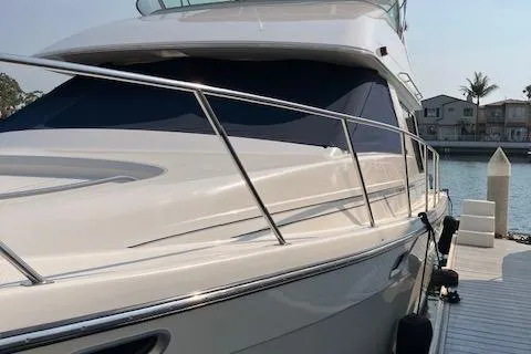 Slide: The Image of 2001 Bayliner 3988 Motoryacht docked by waterfront homes. - 4