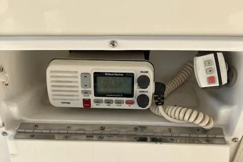 Slide: The Image of VHF marine radio on 2001 Bayliner 3988 Motoryacht, featuring coiled handset and control panel. - 43