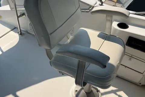 Slide: The Image of Captain's chair on 2001 Bayliner 3988 Motoryacht, featuring sleek design and comfortable seating. - 44