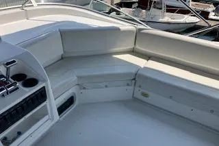 Slide: The Image of 2001 Bayliner 3988 Motoryacht interior with white seating and control panel. - 45