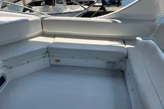 Slide: The Image of 2001 Bayliner 3988 Motoryacht interior seating area with white upholstery. - 46