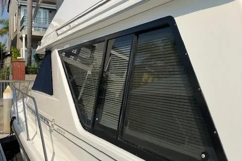 Slide: The Image of 2001 Bayliner 3988 Motoryacht with sleek windows and modern design. - 5