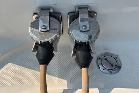 Slide: The Image of 2001 Bayliner 3988 Motoryacht power connections and fuel cap on deck. - 56