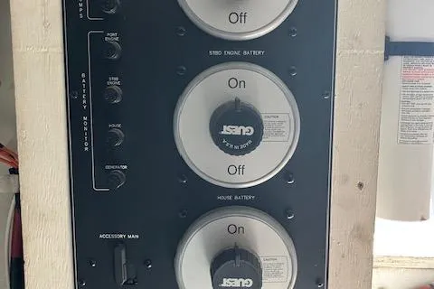 Slide: The Image of Control panel of a 2001 Bayliner 3988 Motoryacht, featuring battery switches and accessory controls. - 57