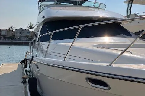 Slide: The Image of 2001 Bayliner 3988 Motoryacht docked at marina, sleek design, sunny day. - 6