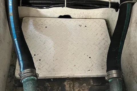 Slide: The Image of Engine compartment of 2001 Bayliner 3988 Motoryacht with hoses and metal plate. - 63