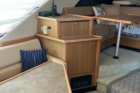 Slide: The Image of 2001 Bayliner 3988 Motoryacht interior with wood cabinetry and seating area. - 8