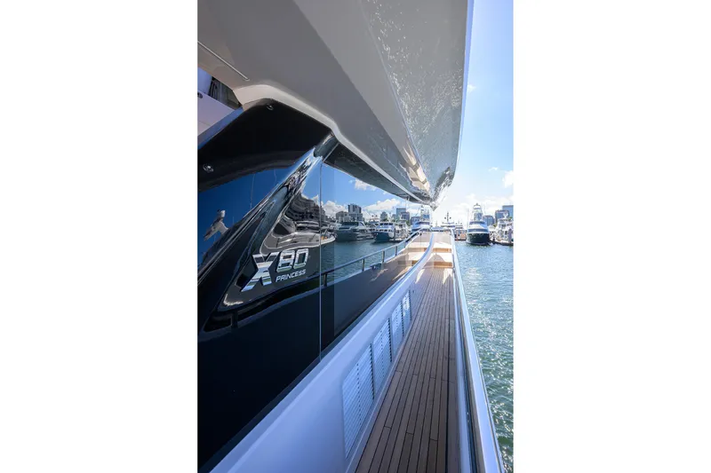 Slide: The Image of Side view of Princess X80 yacht in harbor, year 2026. - 33