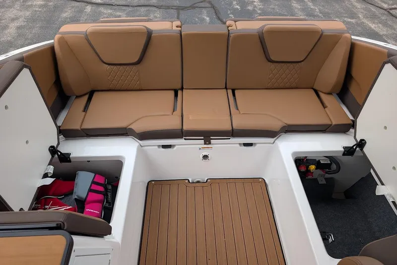 Slide: The Image of 2024 Yamaha Boats 252SE interior with tan seating and storage compartments. - 39