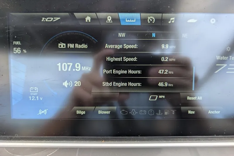 Slide: The Image of Dashboard display of a 2024 Yamaha Boats 252SE showing speed, engine hours, and radio frequency. - 40