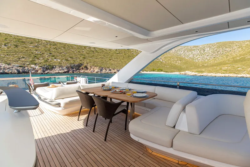 Slide: The Image of Luxurious 2026 Princess Y80 yacht deck with elegant seating and scenic ocean view. - 2