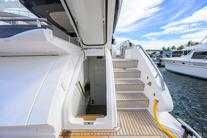 Slide: The Image of Luxurious 2026 Princess S72 yacht with elegant wooden steps and sleek design. - 14