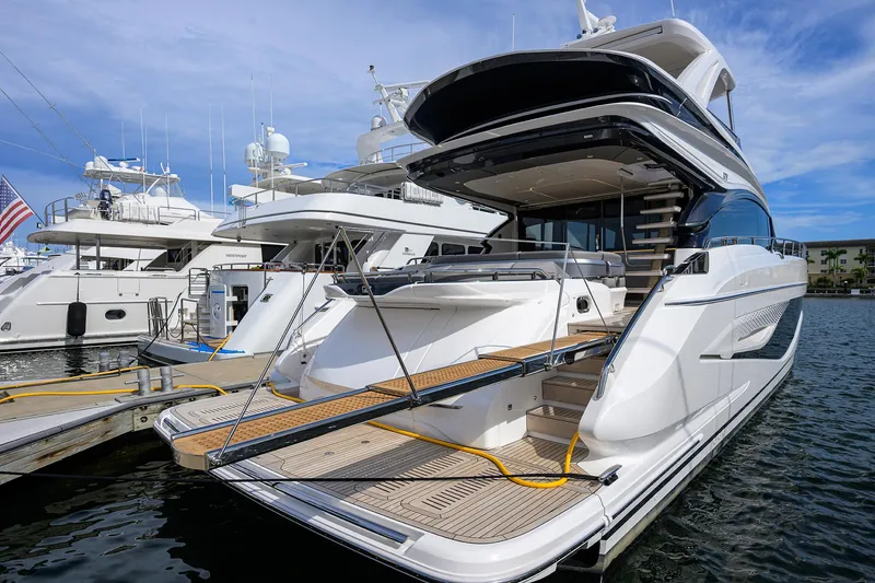 Slide: The Image of Luxury 2026 Princess S72 yacht docked at marina under blue sky. - 16