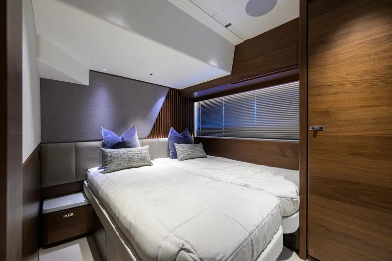 Slide: The Image of Luxurious cabin interior of 2026 Princess S72 yacht with modern bedding and wooden accents. - 24
