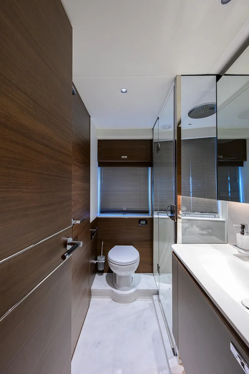 Slide: The Image of Luxurious bathroom in 2026 Princess S72 yacht with modern fixtures and wooden accents. - 25