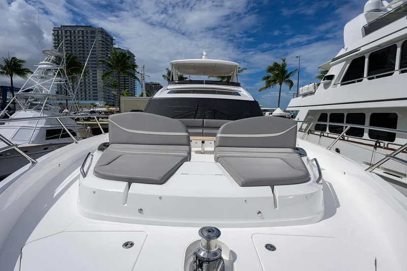 Slide: The Image of Luxury 2026 Princess S72 yacht with sun loungers, docked near palm trees and buildings. - 9