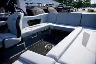 Slide: The Image of 2025 MasterCraft NXT22 boat interior with spacious seating and modern design. - 10