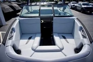 Slide: The Image of 2025 MasterCraft NXT22 boat interior with sleek gray seating and modern design. - 11