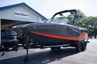 Slide: The Image of 2025 MasterCraft NXT22 boat on trailer at Dyer Marine dealership. - 7