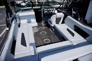Slide: The Image of 2025 MasterCraft NXT22 boat interior with sleek seating and modern dashboard design. - 8