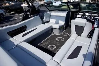 Slide: The Image of 2025 MasterCraft NXT22 boat interior with sleek seating and modern dashboard design. - 9