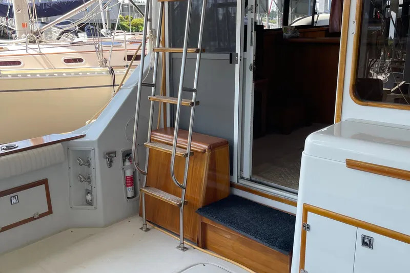 Slide: The Image of 1988 Chris-Craft 392 Sport Fish boat interior with ladder and cabin entrance. - 15