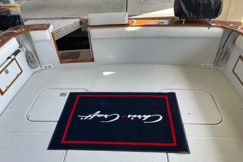 Slide: The Image of 1988 Chris-Craft 392 Sport Fish boat deck with branded mat and seating. - 17