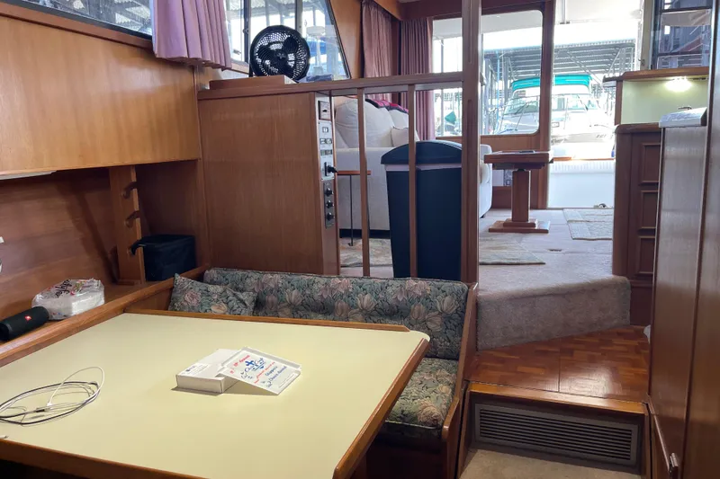 Slide: The Image of Interior of 1988 Chris-Craft 392 Sport Fish boat with dining area and seating. - 24