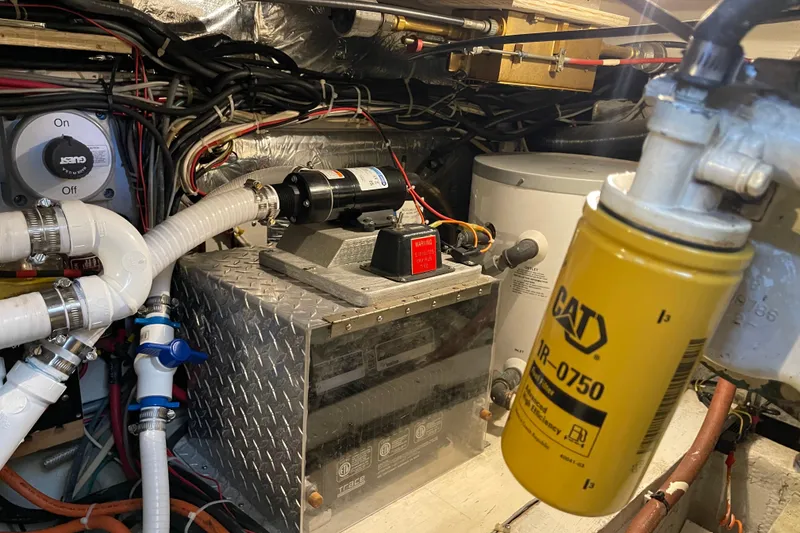 Slide: The Image of Engine room of 1988 Chris-Craft 392 Sport Fish with CAT filter and wiring. - 34