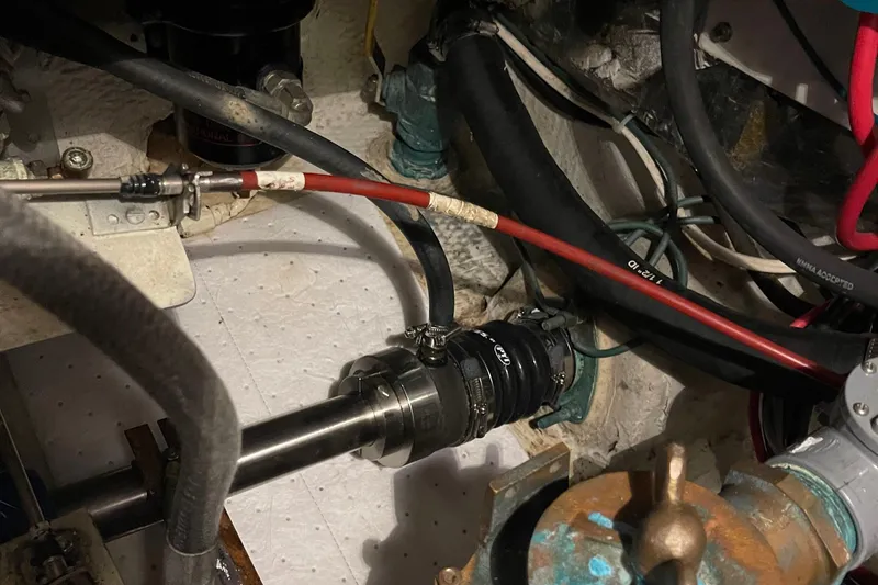 Slide: The Image of Engine compartment of 1988 Chris-Craft 392 Sport Fish with visible hoses and fittings. - 35