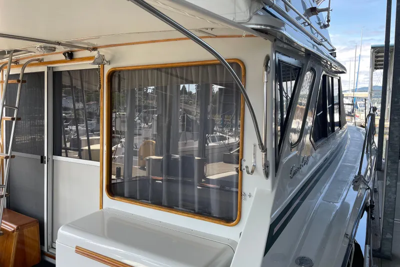 Slide: The Image of 1988 Chris-Craft 392 Sport Fish boat docked, featuring sleek design and spacious cabin. - 37