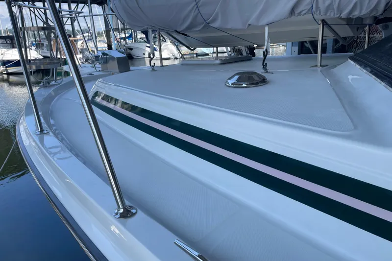Slide: The Image of 1988 Chris-Craft 392 Sport Fish boat deck with railing, docked at marina. - 39