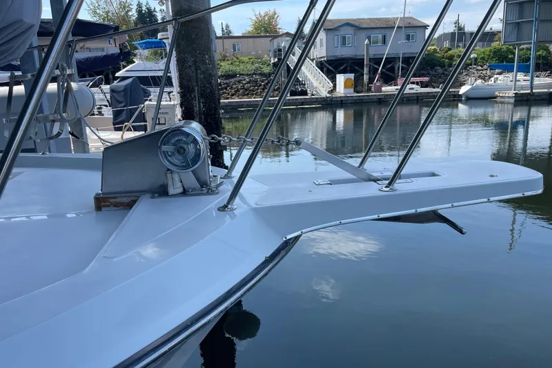 Slide: The Image of 1988 Chris-Craft 392 Sport Fish boat docked at a marina, featuring a sleek bow design. - 41