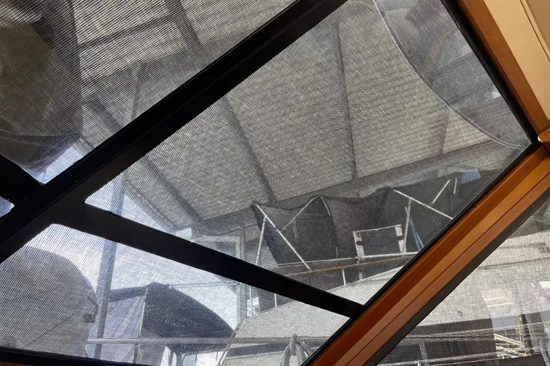 Slide: The Image of 1988 Chris-Craft 392 Sport Fish boat under protective cover in storage facility. - 6