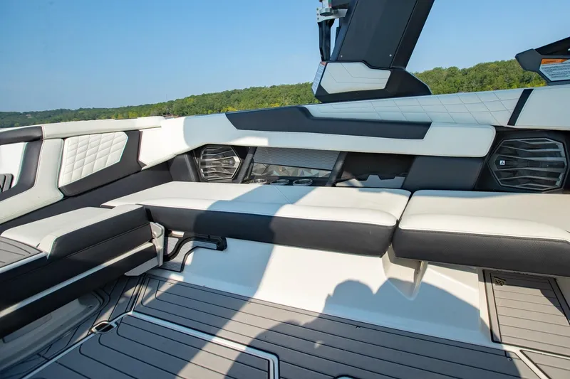 Slide: The Image of 2022 Nautique Super Air Nautique G25 interior with luxurious seating and modern design. - 11
