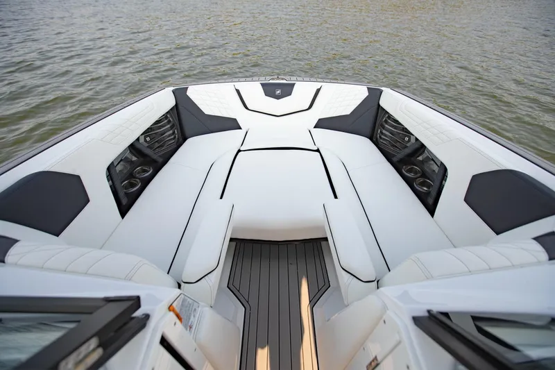 Slide: The Image of Luxurious interior of 2022 Nautique Super Air Nautique G25 boat on water. - 19