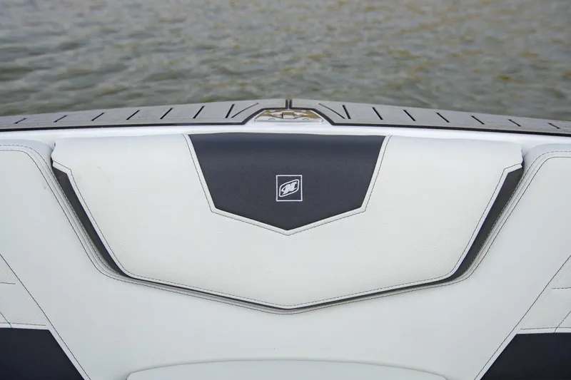 Slide: The Image of 2022 Nautique Super Air Nautique G25 boat interior detail with water backdrop. - 23