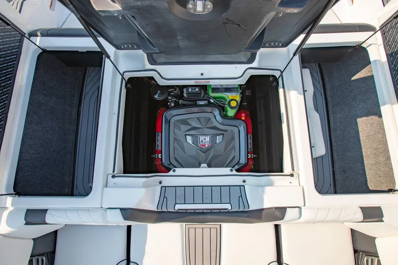 Slide: The Image of 2022 Nautique Super Air Nautique G25 engine compartment, showcasing PCM engine details. - 24