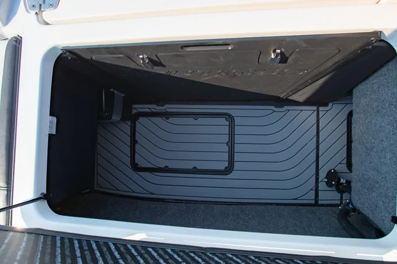 Slide: The Image of Storage compartment of 2022 Nautique Super Air Nautique G25 boat, featuring spacious interior. - 27