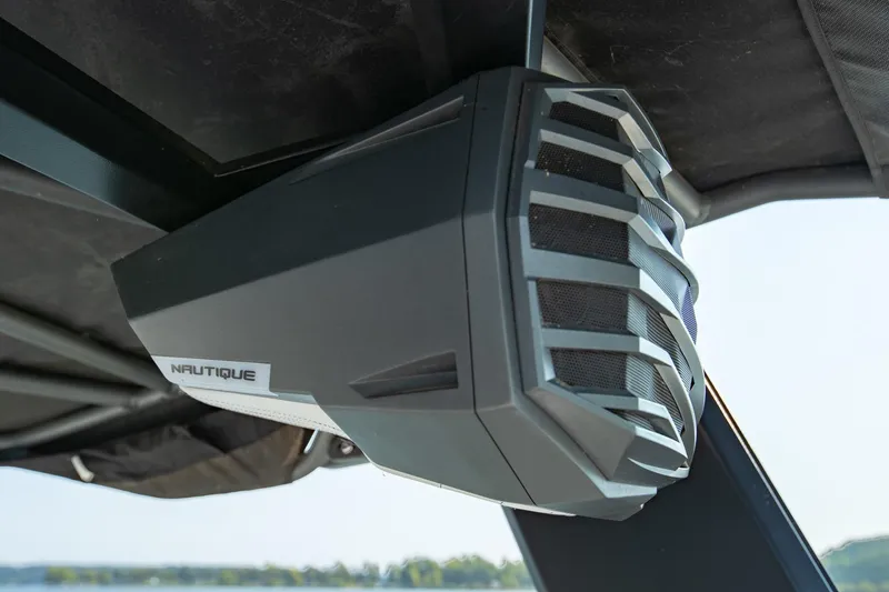 Slide: The Image of 2022 Nautique Super Air Nautique G25 boat speaker, sleek design, mounted under canopy. - 34
